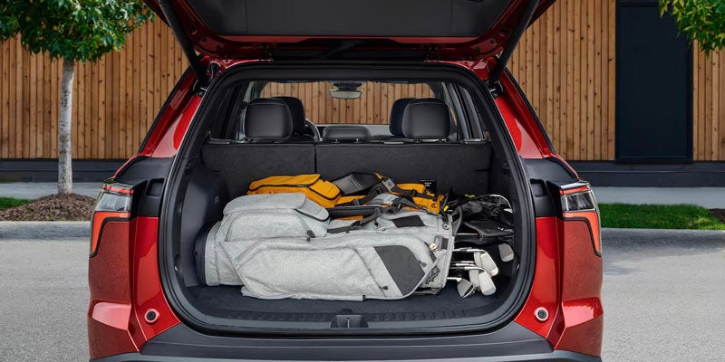 golf bags in boot of Chevy Equinox