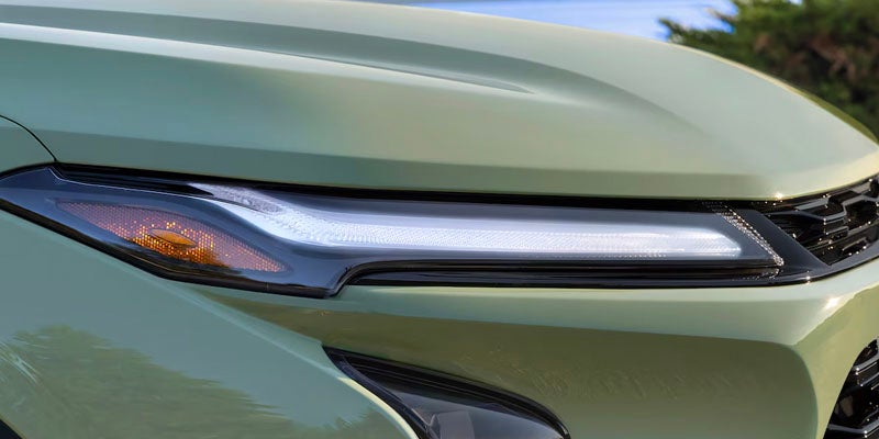 closeup view of green headlight of chevy trax